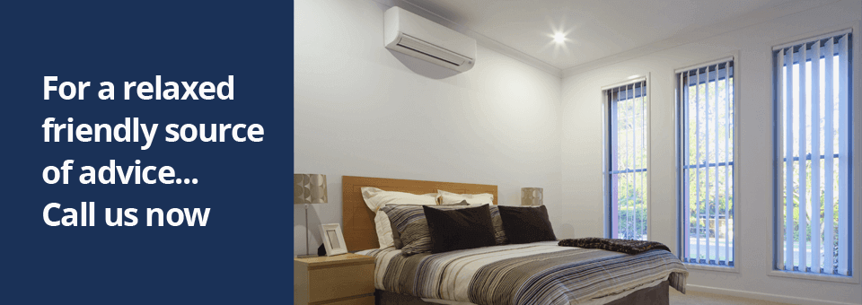 A bedroom featuring a wall mounted air conditioning unit.
